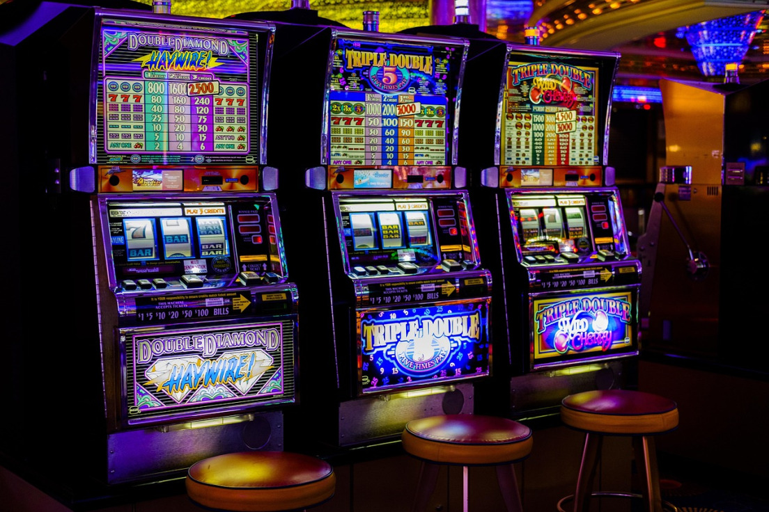 Rows of Pragmatic slot machines glowing inside a modern ASEAN online casino lobby